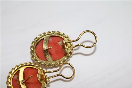 A pair of yellow metal and fluted coral oval earrings, 24mm.